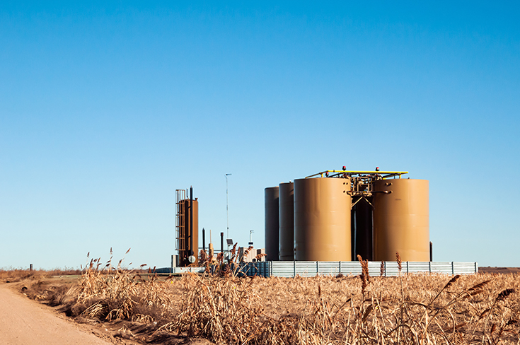 Treater to separate water from oil and tanks to store the oil.