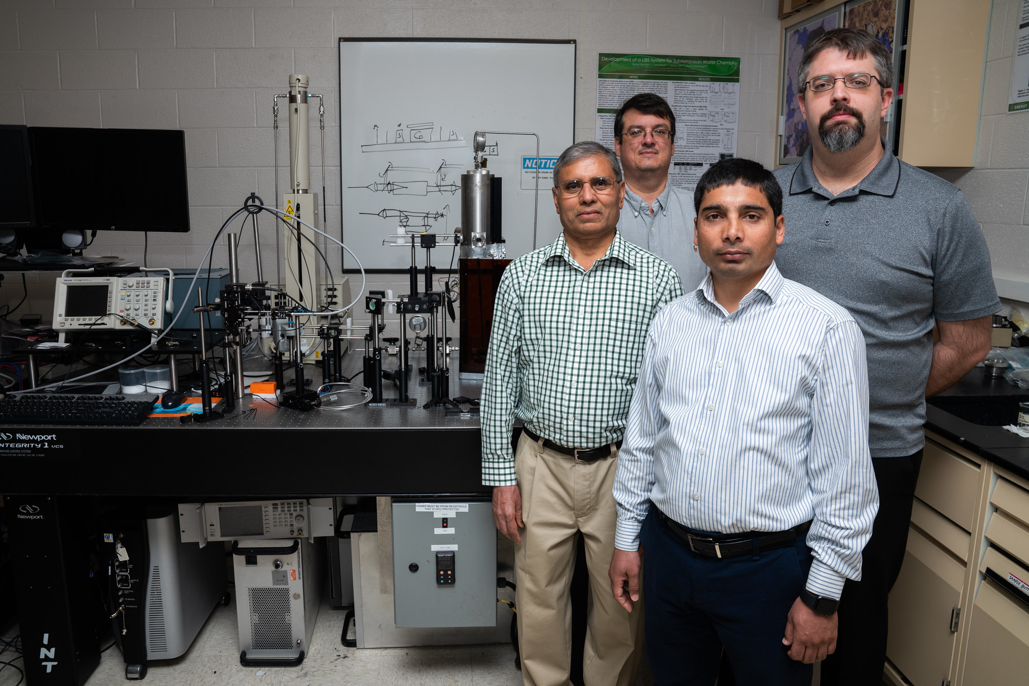 NETL researchers Dustin McIntyre (far back), Jinesh Jain (back left) Dan Hartzler (back right), and Chet Bhatt (front)