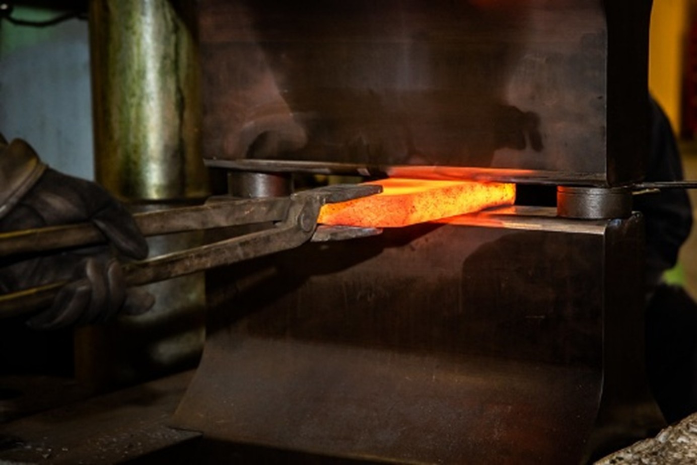 Molten alloy being pressed.