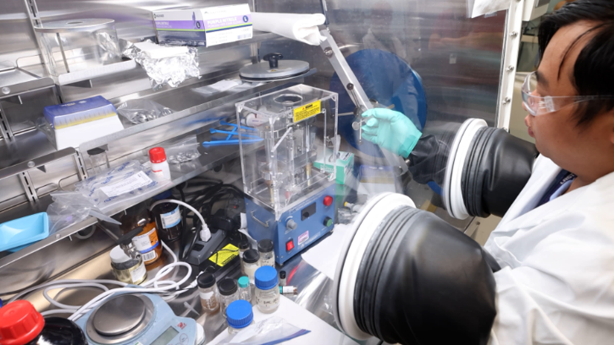 NETL’s Ngoc Tien Huynh uses coal-derived graphite to make a lithium-ion battery for performance testing.