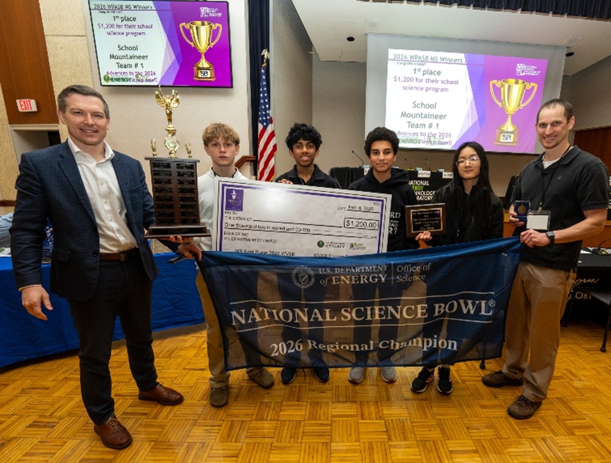 Kyle Haustveit, far left, U.S. assistant secretary for the Office of Hydrocarbons and Geothermal Energy, celebrates with Mountaineer Middle School Team 1, winner of the 2026 WVSB middle school championship.