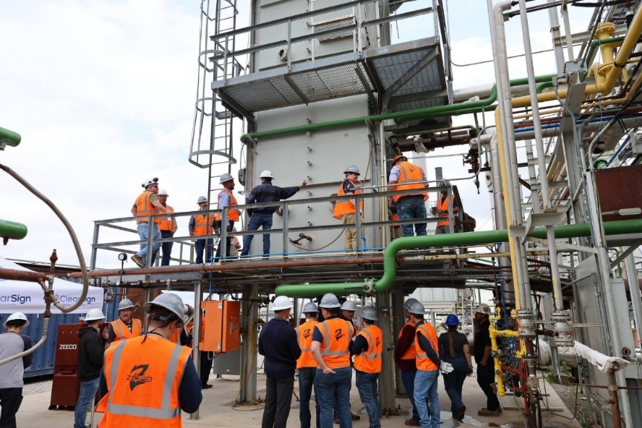 Industry professionals gathered around the demonstration furnace to see the ClearSign Core™ 2 operating live in a real-world setting. Image provided by ClearSign Technologies Corporation