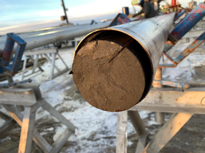 Figure 2.  A view of the Mowry shale core inside a liner just after retrieval from the well and before wrapping/packaging for transport to the laboratory.