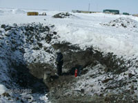 Excavation around plugged casing before backfilling