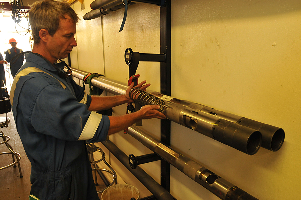 The science team prepares the PCTB pressure coring tool for deployment at GC955.