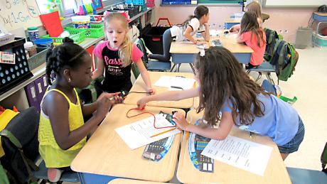 Students at Clara Barton Elementary School participate in the “Simple Circuits” activity to learn about the concept of electricity. 