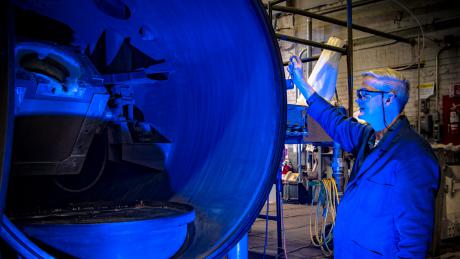 Metallurgist Paul Jablonski works with an induction furnace at NETL’s Albany site.  