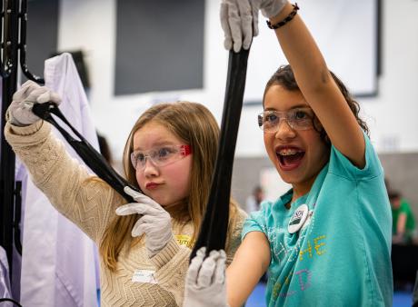 Fifth grade students make slime at NETL “hands-on stations.” 