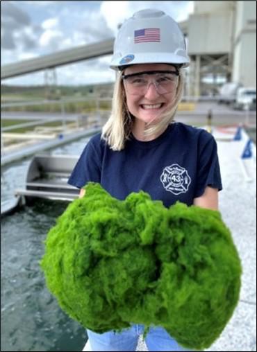 University of Central Florida student Emily Rushing holds algae she harvested from the NETL-supported algae CO2 utilization research site at the Stanton Energy Center, Orlando, Florida. Photo Credit: MicroBio Engineering