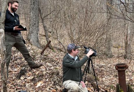 Matt Reeder uses an infrared camera to complete fieldwork as part of NETL’s abandoned well research project near Olean, New York. He is joined by Nathan Graber of the New York Department of Environmental Conservation. The photo was taken in March 2022. It was the first of three research trips by NETL to the site.