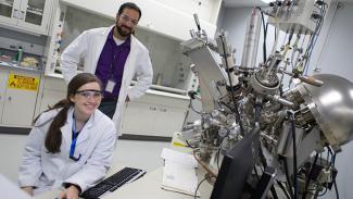 Doug Kauffman and Mickey Leland Intern Dana Capitano characterizing catalysts using an X-ray photoelectron spectrometer