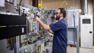 John Johnson operates a state-of-the-art variable frequency microwave reactor in the newly commissioned Reaction Analysis and Chemical Transformation (ReACT) facility in Morgantown.