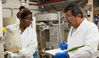 Mickey Leland inten Annuli Okoye with mentor Dushyant Shekhawat in the lab at NETL in Morgantown, WV.