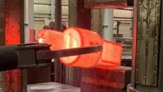 A photo of the forging of a steam turbine rotor.