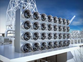 A picure of 32 fans arranged in a 4 by 8 rectangular pattern on a roof against a bright blue sky.