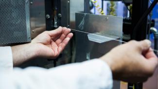 A developer touching the optical pH sensor.