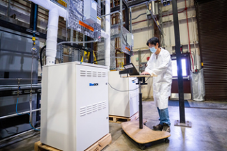 Jian (Jay) Liu monitors the performance of 4 1.5kW SOFC stacks being stress tested to evaluate the stacks’ suitability for use in data center applications.