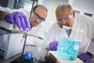 NETL researcher Mac Gray (right) works with colleague Chris Wilfong.