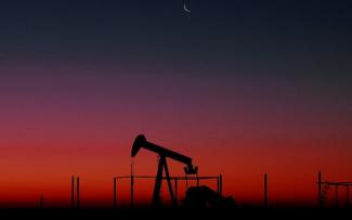 An oil rig at sunset.