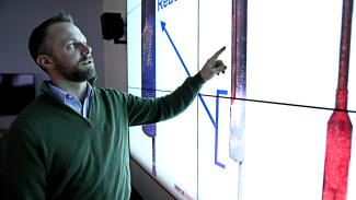 NETL’s Jordan Musser examines multiphase flow within a reactor using the Lab’s Multiphase Flow with Interphase eXchanges (MFiX) code.