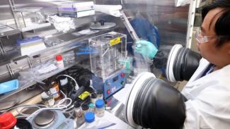 NETL’s Ngoc Tien Huynh uses coal-derived graphite to make a lithium-ion battery for performance testing.